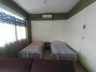 Cama o camas de una habitación en El Refugio
