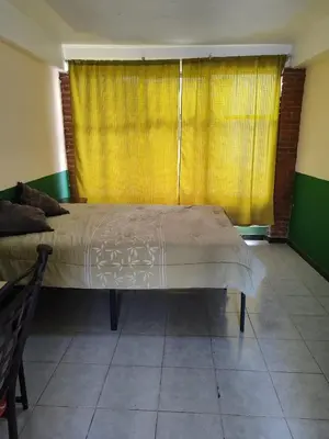 Cama o camas de una habitación en Departamentos del Jardín de Toribio