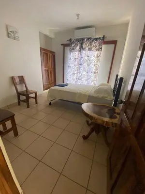 Cama o camas de una habitación en ESPERANZA Casa de Huéspedes