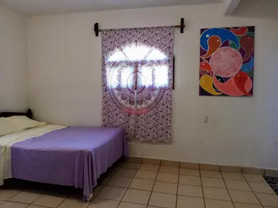 Cama o camas de una habitación en ESPERANZA Casa de Huéspedes