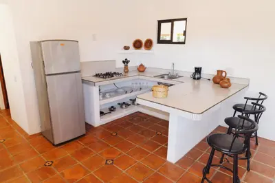 Una cocina o zona de cocina en El departamento de los Nonos