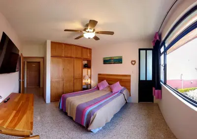 Cama o camas de una habitación en Luz Casa de Huespedes