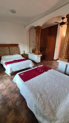 Cama o camas de una habitación en Hotel Leyenda del Tepozteco
