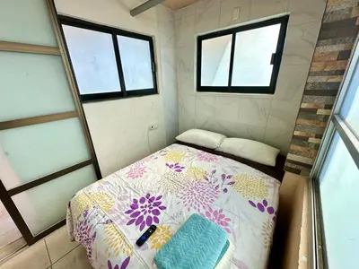 Cama o camas de una habitación en Alojamientos Xolotl