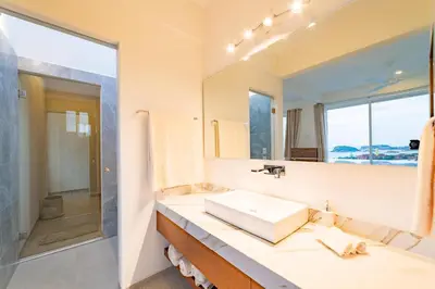 Un baño de 3047 - Villa Manguito
