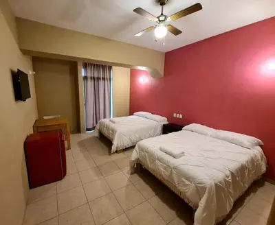 Cama o camas de una habitación en Hotel Arcadia Cuernavaca