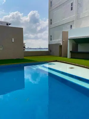 Piscina en o cerca de Vista a Playa con Alberca en Blvd principal frente al Mar 3hab