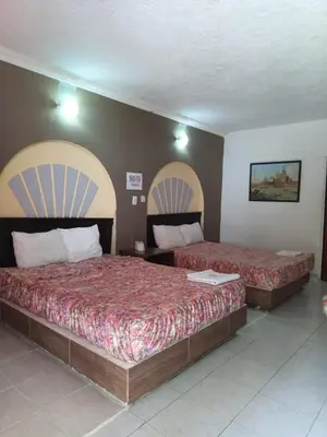 Cama o camas de una habitación en Hotel Narváez Dorado Centro de Convenciones