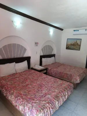 Cama o camas de una habitación en Hotel Narváez Dorado Centro de Convenciones