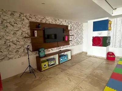Una televisión o centro de entretenimiento en Departamento Moderno con Vista al Mar