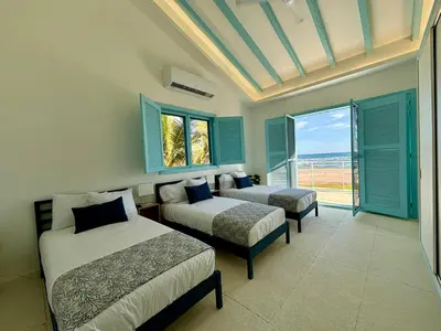 Cama o camas de una habitación en Casa Playa Infinita