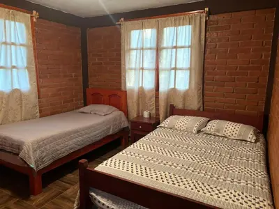Cama o camas de una habitación en Cabaña la Escondida