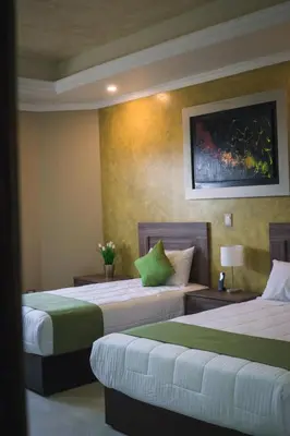 Cama o camas de una habitación en Hotel Quinta Los Laureles