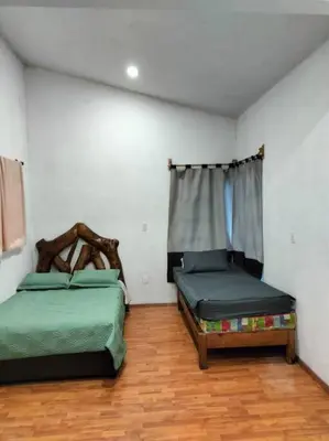 Cama o camas de una habitación en Casa de las iguanas