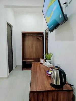Una televisión o centro de entretenimiento en Hotel Punta Colibrí