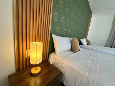 Cama o camas de una habitación en Hotel Punta Colibrí