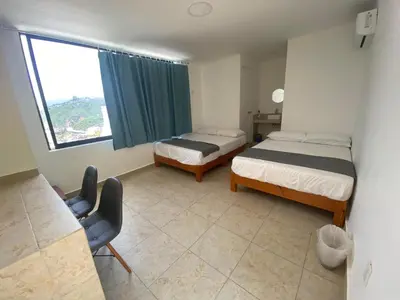 Cama o camas de una habitación en Villa Panoramica 2 pisos, piscina vista al mar