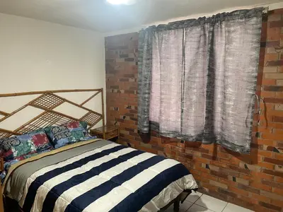 Cama o camas de una habitación en Depa cerca hospital Issste y jardines de fiesta