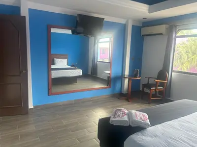 Cama o camas de una habitación en Auto Hotel El Cine