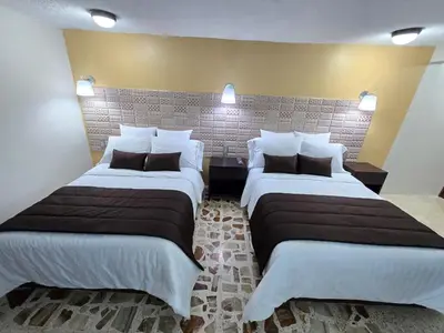 Cama o camas de una habitación en Condesa Hotel Boutique Zacatlán