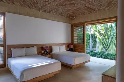 Cama o camas de una habitación en Casa Yaa - La Flia Beachfront Luxury