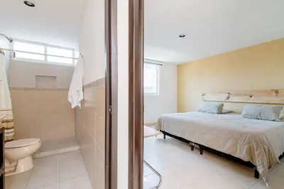 Cama o camas de una habitación en Habitación con Cama King Size en Puebla, Puebla