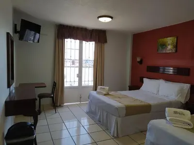 Cama o camas de una habitación en Hotel RENACIMIENTO