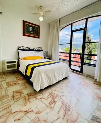 Cama o camas de una habitación en Hotel Presidente Vicente Guerrero