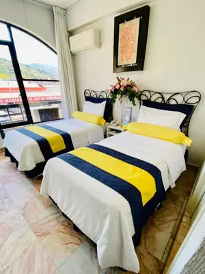 Cama o camas de una habitación en Hotel Presidente Vicente Guerrero