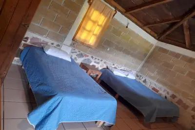 Cama o camas de una habitación en OYO Hotel Rincon De Texolo