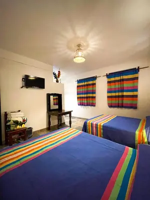 Cama o camas de una habitación en Hotel Yalnazac Mitla
