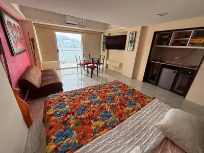 Cama o camas de una habitación en Apartamento con vista al mar