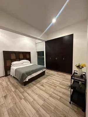 Cama o camas de una habitación en Blue Towers Piso 9 - Departamento Moderno en Puebla
