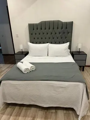 Cama o camas de una habitación en Blue Towers Piso 9 - Departamento Moderno en Puebla