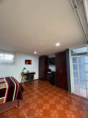 Una televisión o centro de entretenimiento en Cómoda habitación en Coyoacán