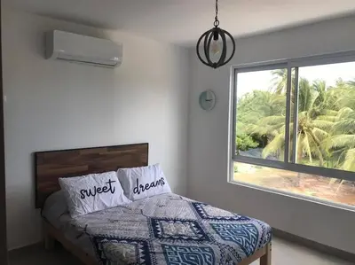 Cama o camas de una habitación en Hermoso Departamento con club de playa en diamante