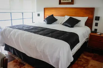 Cama o camas de una habitación en Hotel Casa María