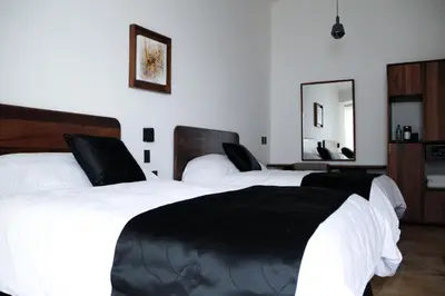 Cama o camas de una habitación en Hotel Casa María