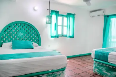 Cama o camas de una habitación en Hotel Costa 55 Puerto Escondido