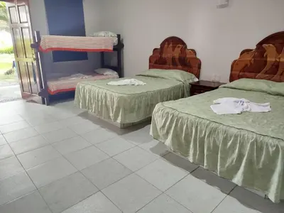 Cama o camas de una habitación en Playa Encantada