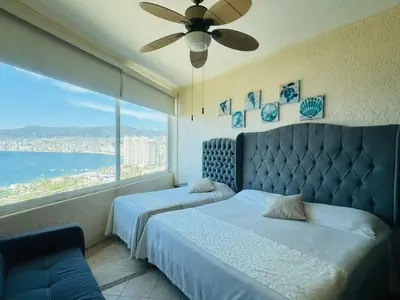 Cama o camas de una habitación en 3 Atardeceres, Pet Friendly Vista al Mar en Brisas