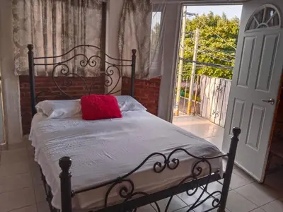 Cama o camas de una habitación en Hotel La Laguna