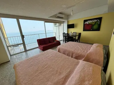 Cama o camas de una habitación en Playa dorada