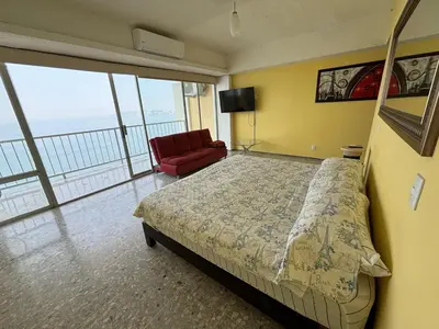 Cama o camas de una habitación en Playa dorada