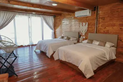 Cama o camas de una habitación en Riverside Hotel Chachalacas