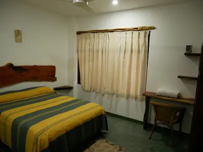 Cama o camas de una habitación en Madre Tierra Hostal