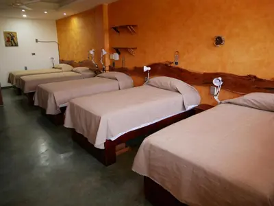Cama o camas de una habitación en Madre Tierra Hostal
