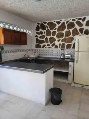 Una cocina o zona de cocina en Tranquilo y cómodo Bungalow
