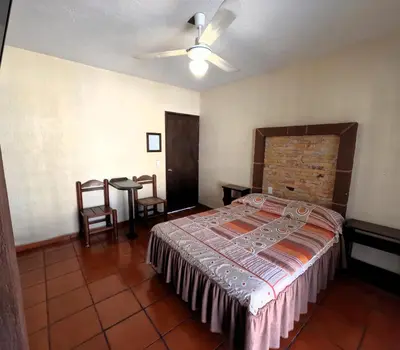 Cama o camas de una habitación en Hotel Sta Cruz Oaxtepec
