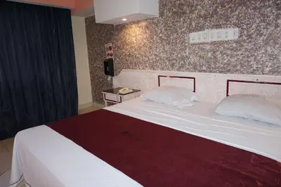 Cama o camas de una habitación en Hotel Rio Inn